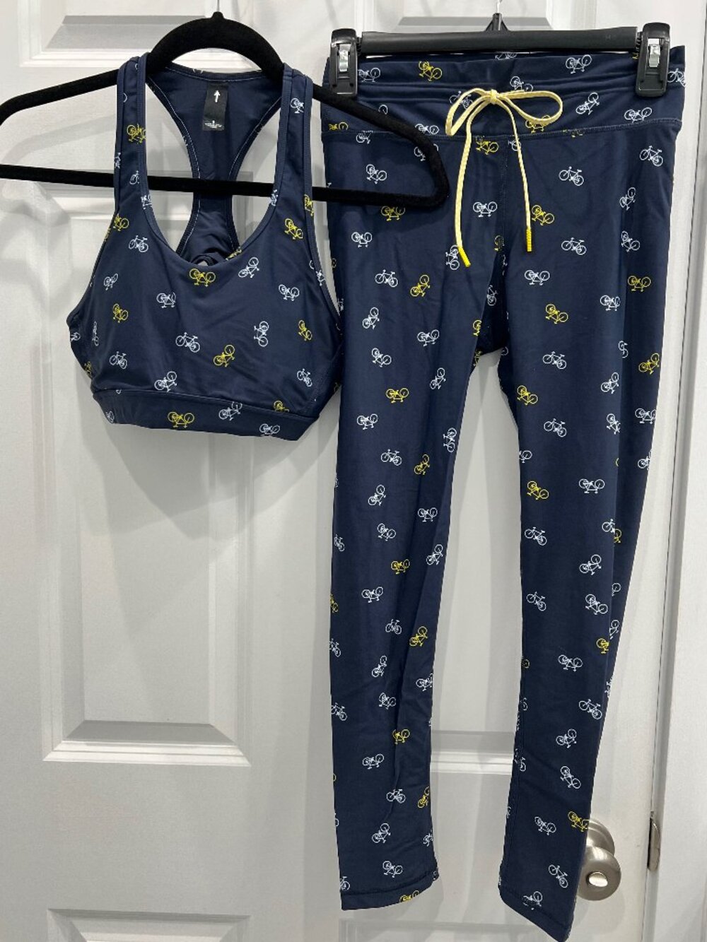 The Upside/Soul Cycle bra & leggings (both 6); navy w/white, yellow bike pattern